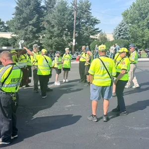 Fire police volunteers gathered near a fire truck during an event